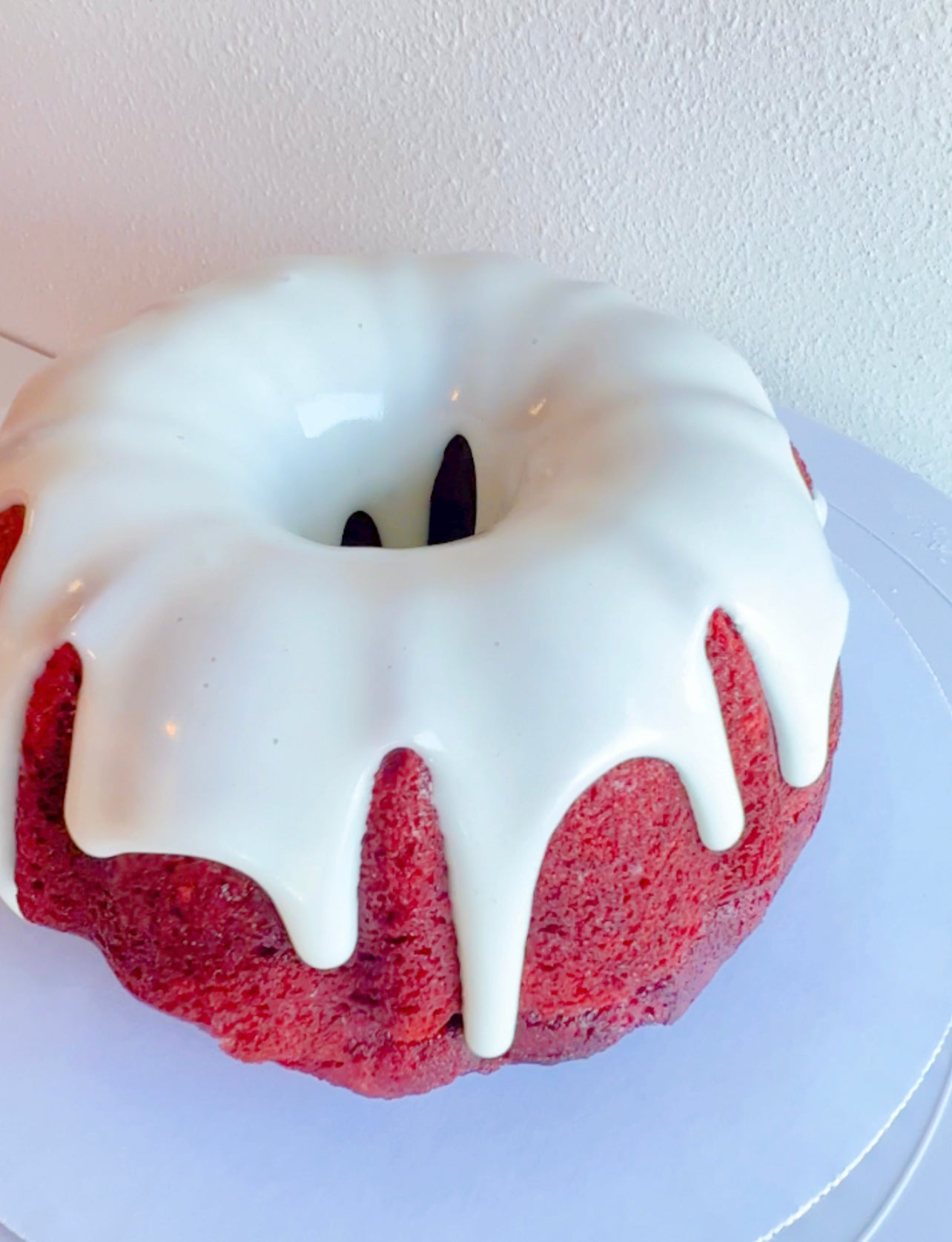 rich and moist mini bundt cakes with creamy frosting.